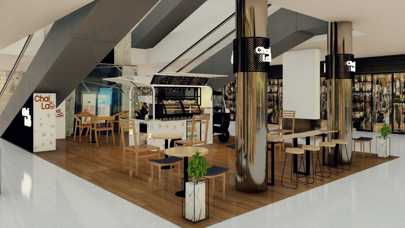 Café kiosk fitout with seating and a branded counter in a shopping mall atrium