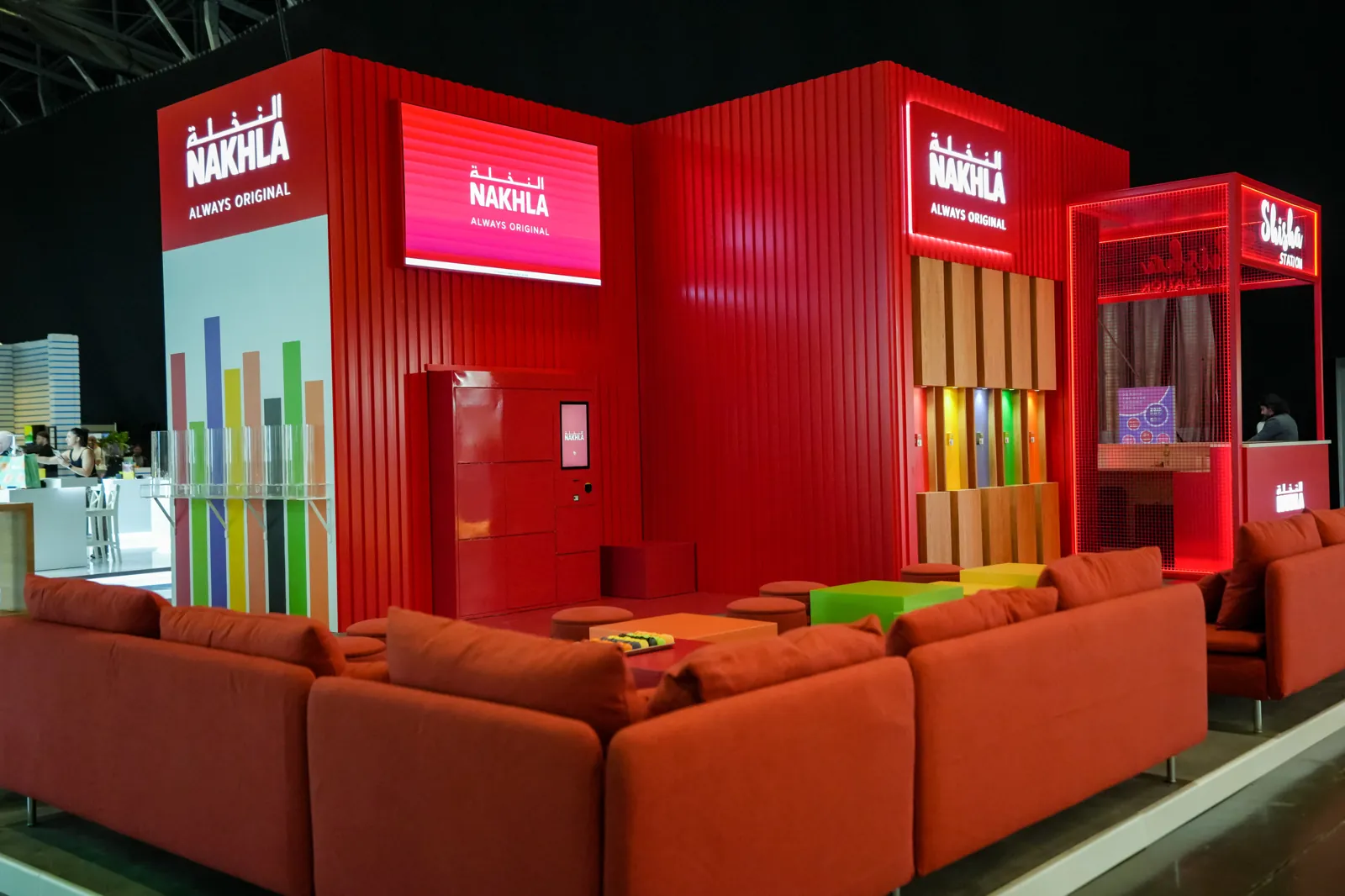 Branded trade show stand with lounge seating